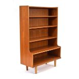 A 1970's teak open-faced 'waterfall' bookcase on later tapering legs, 84 x 34 x 126 cm