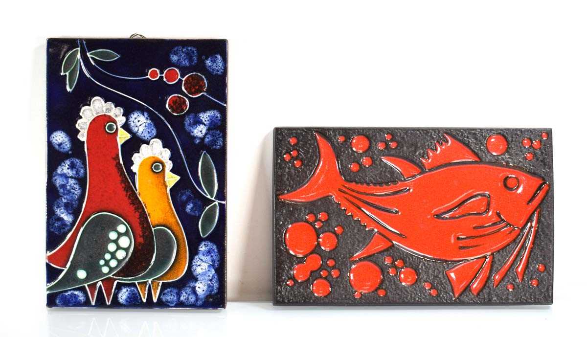 A ceramic wall plaque depicting a bright red fish, 32 x 20 cm, together with another modelled as two