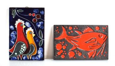 A ceramic wall plaque depicting a bright red fish, 32 x 20 cm, together with another modelled as two