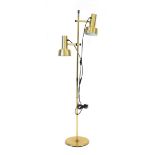 A 1970's Danish brass-finished twin-spot standard floor lamp Lead cut, working order unknown, some