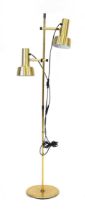 A 1970's Danish brass-finished twin-spot standard floor lamp Lead cut, working order unknown, some