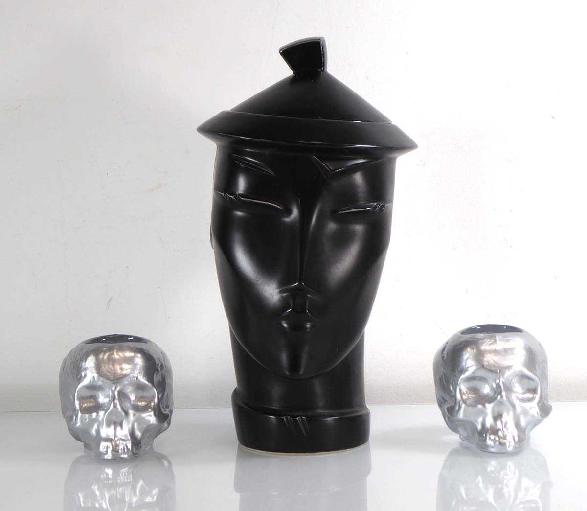 Attributed to Lindsey B, a 'Peking' jar in black together with a pair of Kosta Boda votive skulls ( - Image 2 of 2
