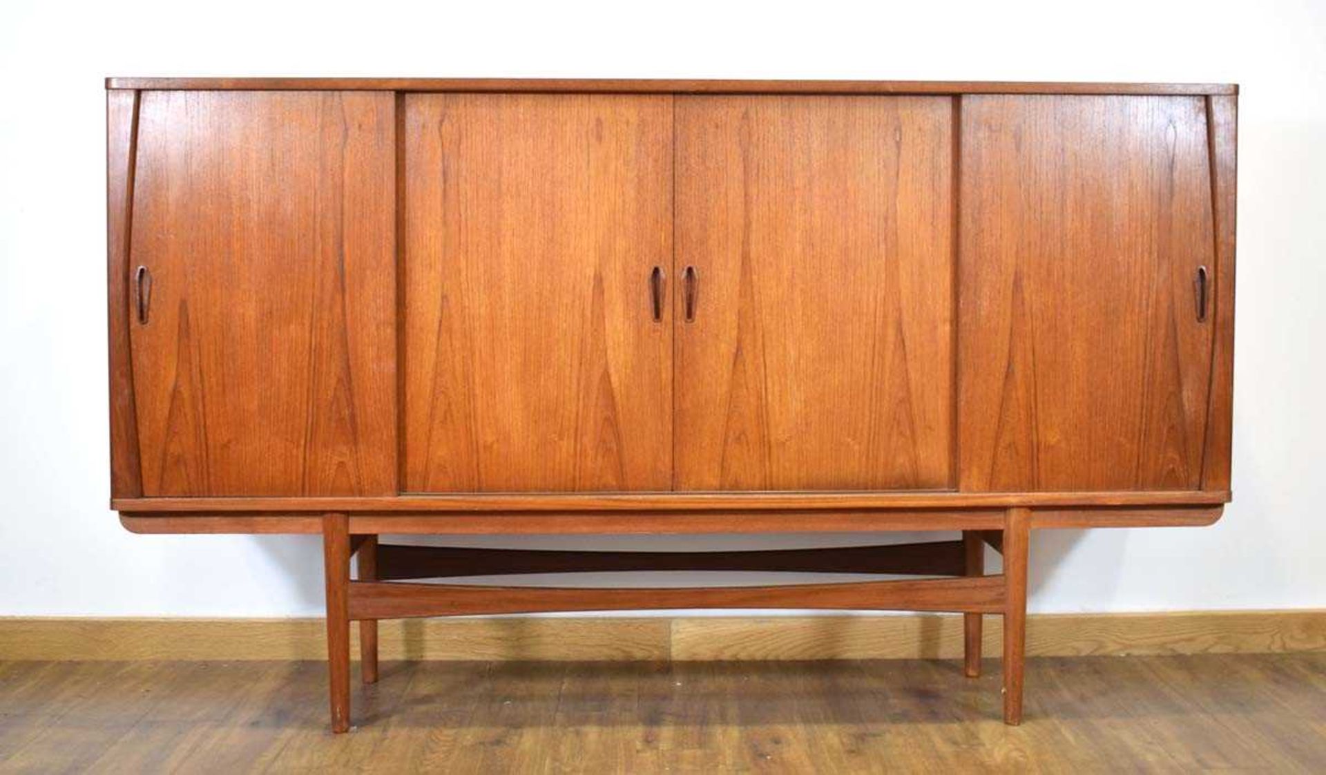 A 1960's Danish teak sideboard cabinet, the four sliding doors enclosing an arrangement of - Image 2 of 3