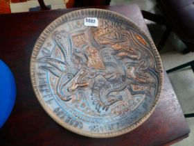 A Swedish pottery charger by Tilgmans Keramik decorated with a figure on horseback, impressed marks,