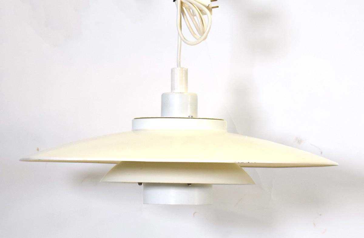 A Danish white enamelled four-tier open ceiling light in the manner of Louis Poulsen