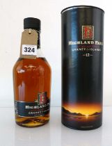 An old bottle of Highland Park 12 year old Single Malt Scotch Whisky circa 1990's dumpy bottle