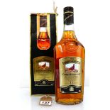 An old bottle of The Famous Grouse Gold Reserve 12 year old Deluxe Scotch Whisky (Discontinued)