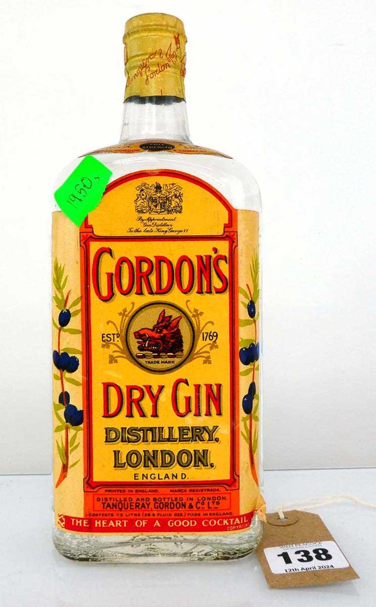 An old bottle of Gordon's Dry London Gin "By appointment to the late King George VI" Full Strength