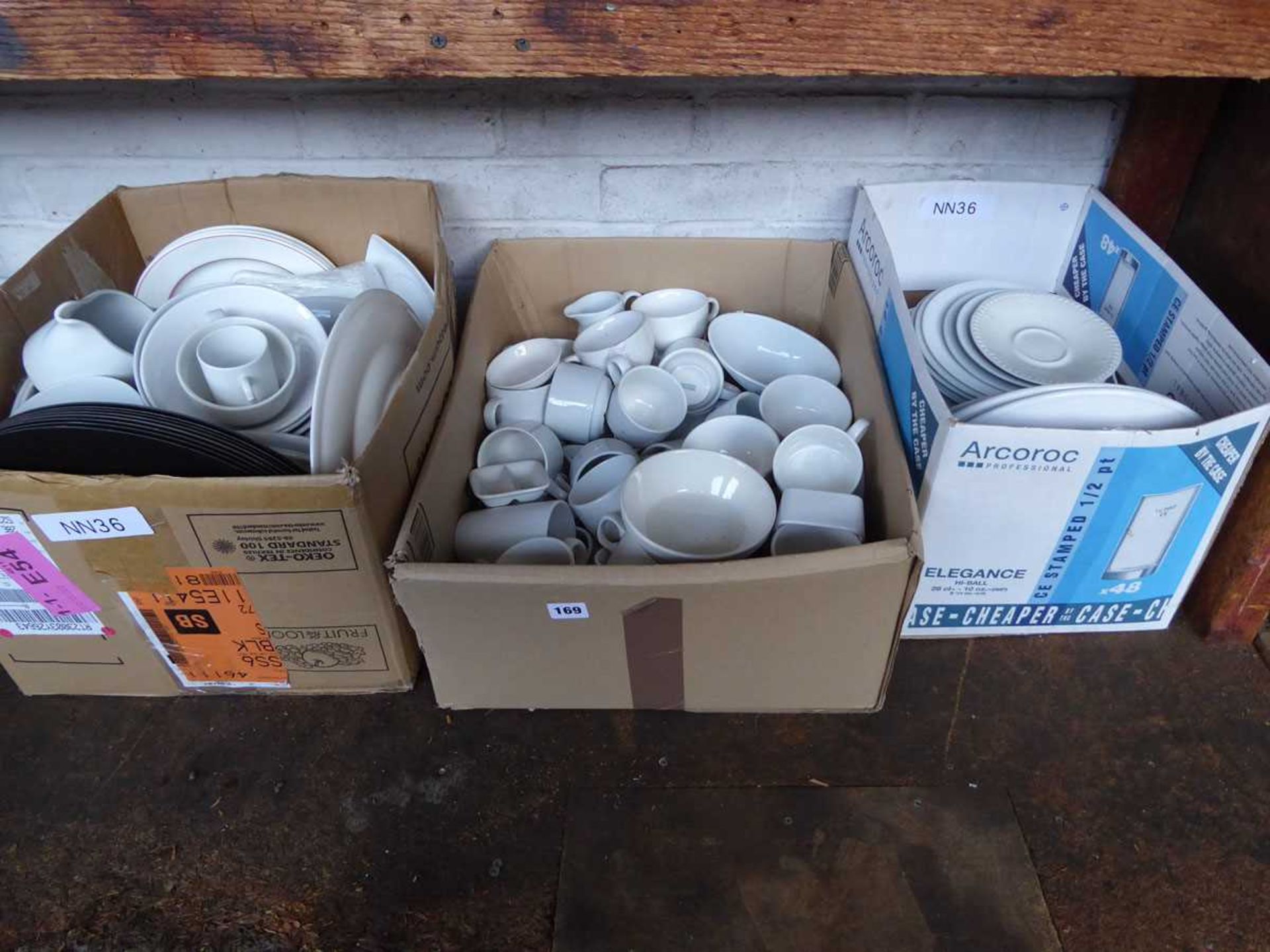 3 boxes containing a large qty of mostly white crockery comprising side plates, dinner plates, cups,