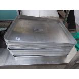 Stack of 9 large aluminium oven trays