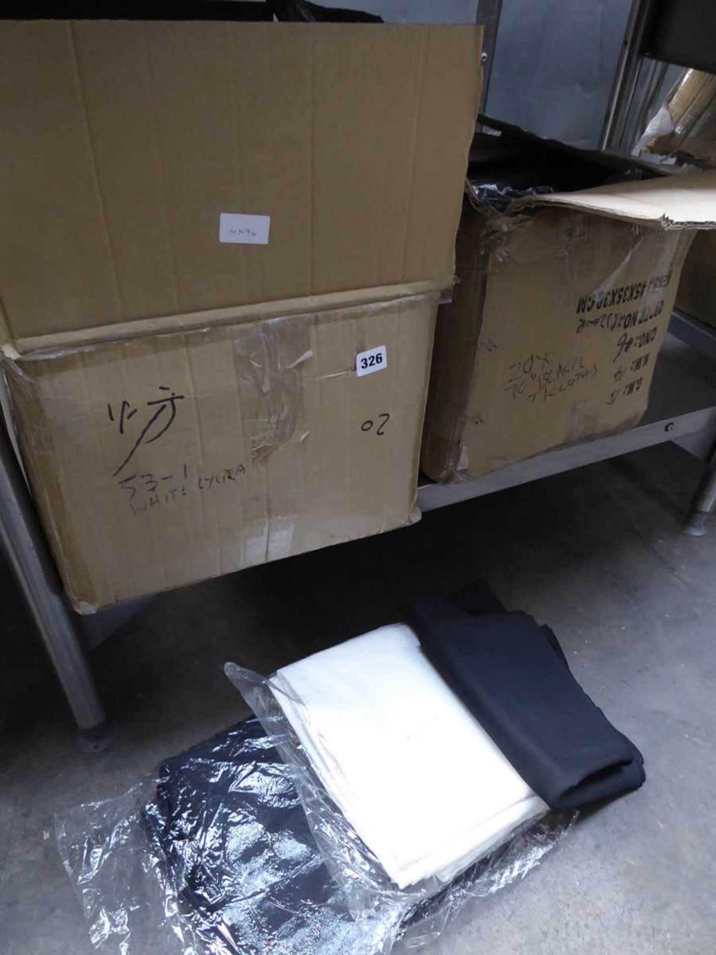 2 x large boxes containing black and white table cloths