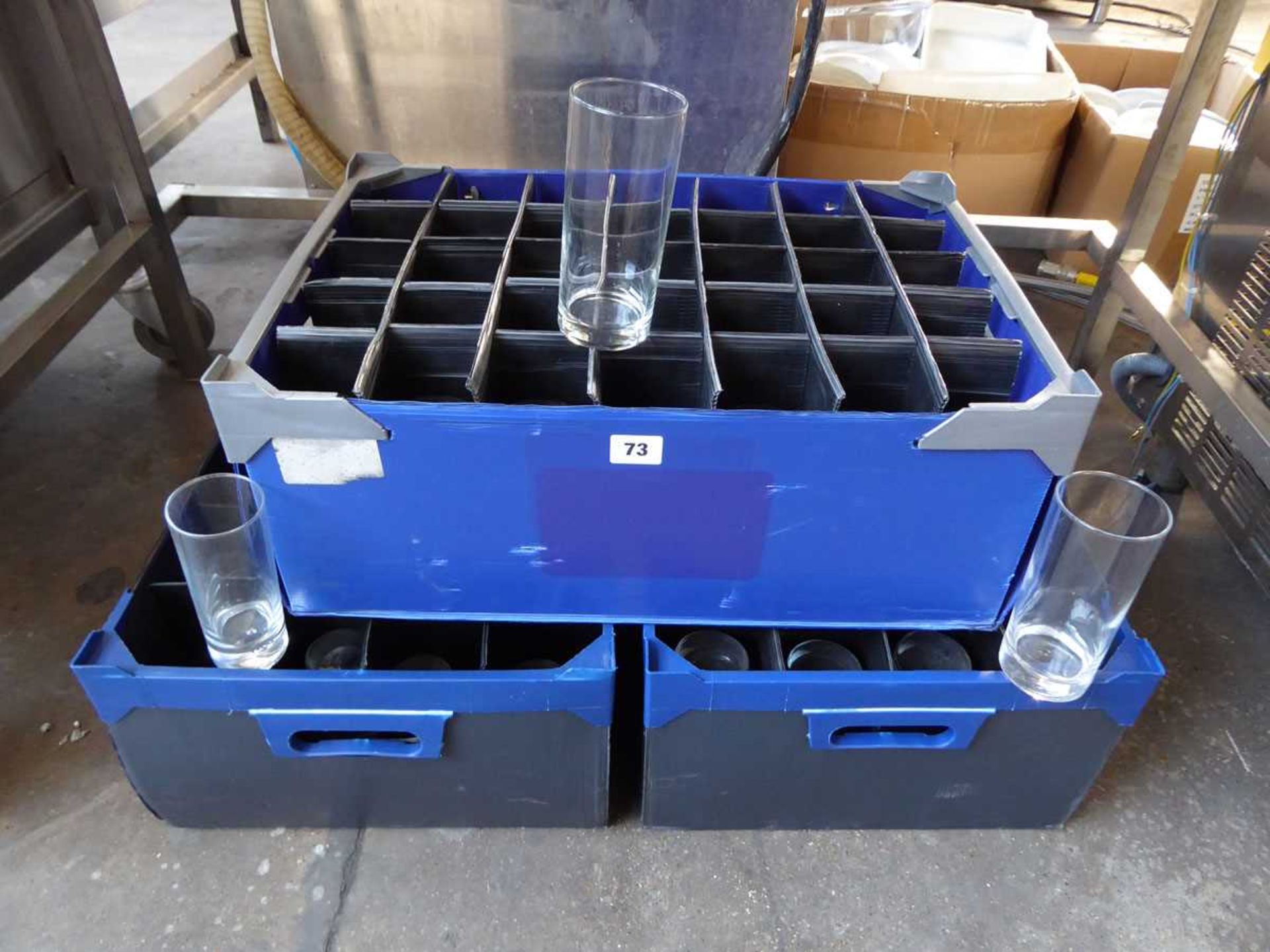 3 plastic stacking crates containing a large qty of high ball glasses