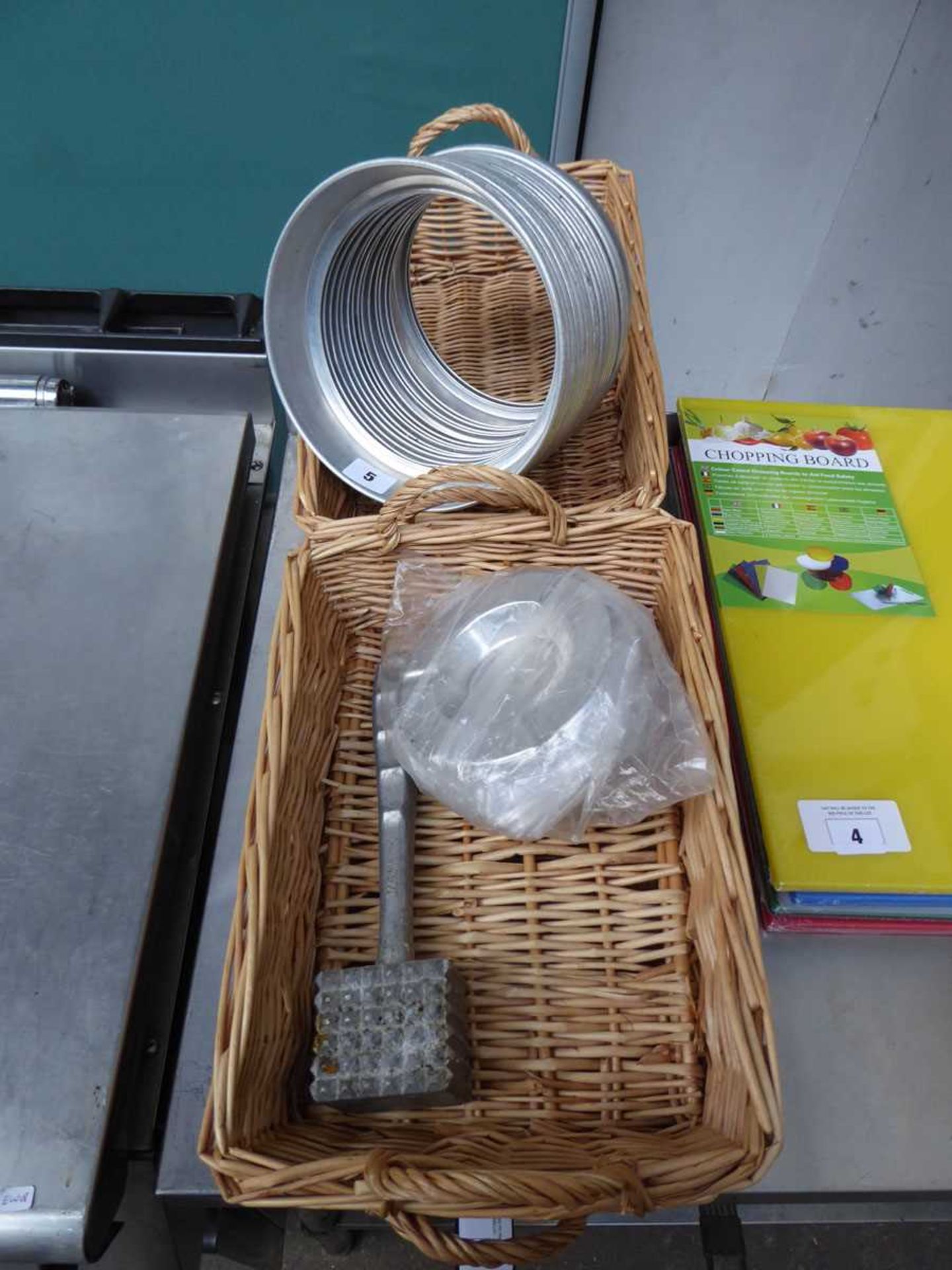 4 wicker baskets plus a stack of aluminium plate rings, a meat tenderiser and some ashtrays