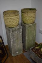 A pair of concrete cuboid plinths, h. 73 cm, together with a pair of trellis relief planters, di. 32