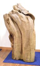 'Natural Driftwood Sculptures': an organic garden structure bearing a maker's plaque, weathered,