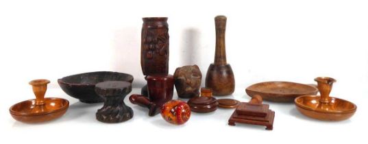 A group of treen including a carved wooden zoomorphic finial, a leg, string holder, a pair of