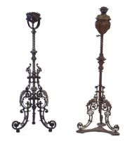 Two 19th century case metal and brown patinated oil lamp stands of Rococo form on tripod bases (2)