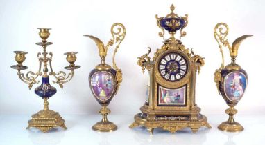 A 19th century French mantel clock, the brass body of architectural form with porcelain panels, h.
