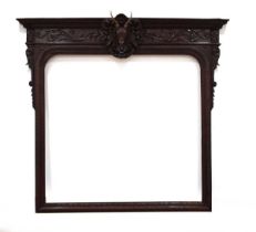 A Victorian carved oak overmantle mirror frame, the frieze with relief swags and a relief deer