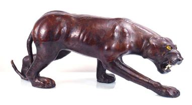 A leather covered snarling panther with glass eyes, in the manner of Omersa for Liberty, w. 72 cm