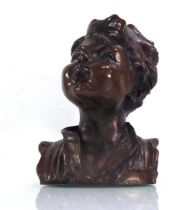 A brown patinated bronzed head and shoulders bust modelled as a young boy, h. 19 cm