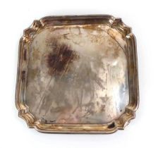 A mid-20th century silver salver of square form on four scrolled feet, William Hutton & Sons,