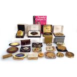 A group of decorative compacts including one modelled as a vintage camera (20) together with a