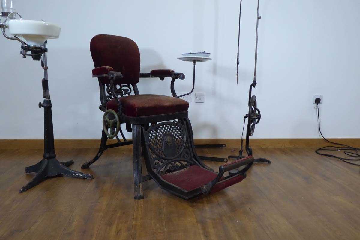 A 19th century cast metal reclining dentists' chair, a WDM Co. pedal operated drill and a rinsing - Image 2 of 14