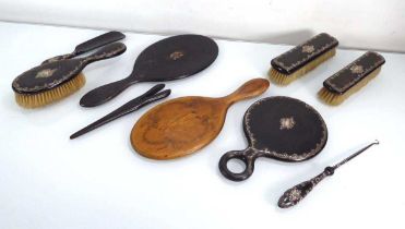 Seven early 20th century ebonised and metalware mounted dressing table items, a similar pair of