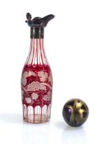 A ruby flash glass claret jug, h. 23 .5 cm and an Isle of Wight glass paperweight of spherical form,