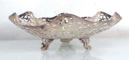 A pierced silver tazza of flowerhead form on three scrolled feet, maker CK, London 1959, d. 23 cm,