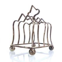 An Edwardian silver four-slice toast rack, maker RMEH, Sheffield 1909, w. 9.5 cm, 3.5 ozs Mis-