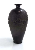 A Japanese Export bronze finish vase of ovoid form, relief decorated with a dragon, h. 28.5 cm