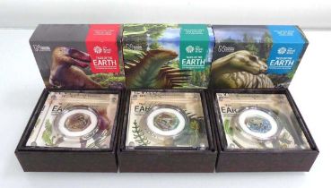 Three Royal Mint Tales of the Earth Dinosaur Collection coloured silver 50p coins, all cased (3)