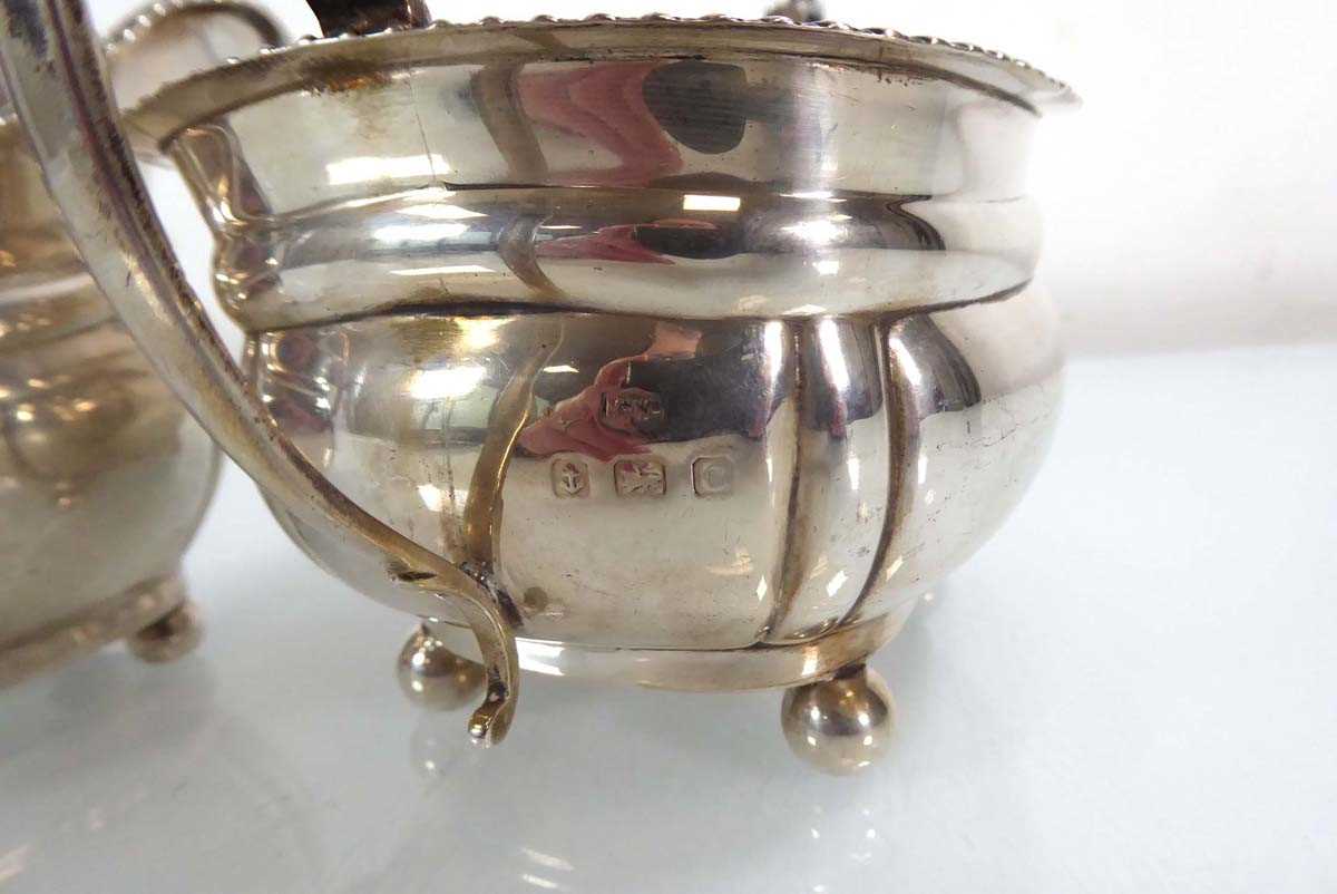 An early 20th century silver two handled sugar bowl with gadrooned decoration, together with a - Image 4 of 4