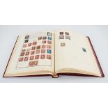 An album of Victorian and later stamps including three One Penny Reds, three Two Pence Blues,