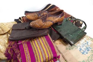 A group of textiles including two vintage handbags, brocade panel, a pair of faux crocodile skin