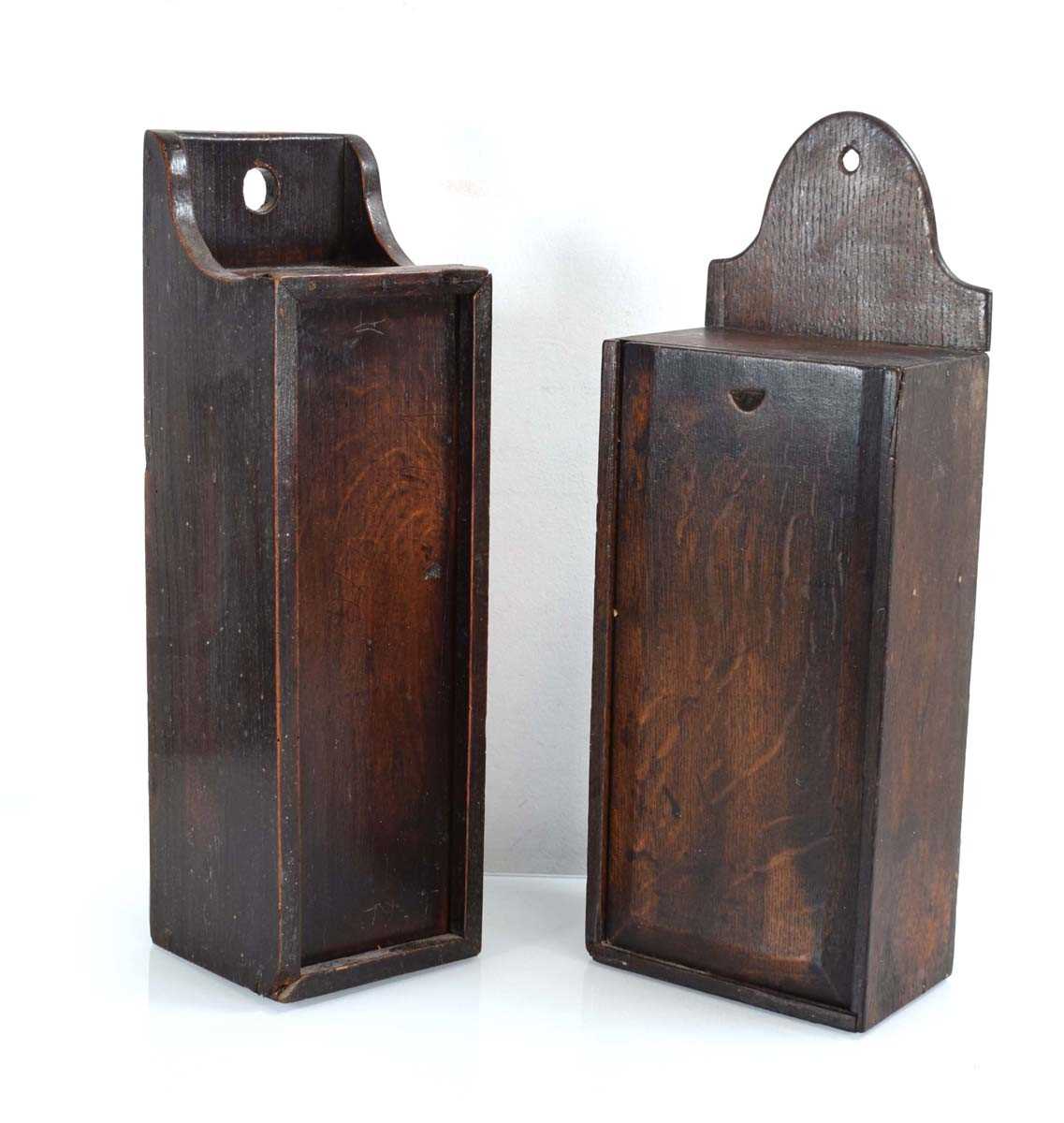 Two Georgian oak wall-mounted candle boxes (2) Backs both loose. Some old worm to both but