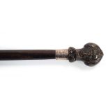 A 19th century silver-mounted walking cane with a figural pommel, inscribed 'JJJ 14 Upper Brook