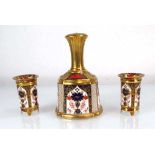 A Royal Crown Derby bell decorated in the 1128 pattern, h. 14 cm, together with a pair of