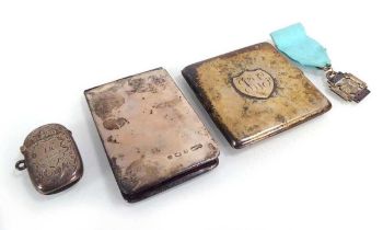 A mixed group of silver comprising a cigarette case, a vesta case, a folding purse and a National