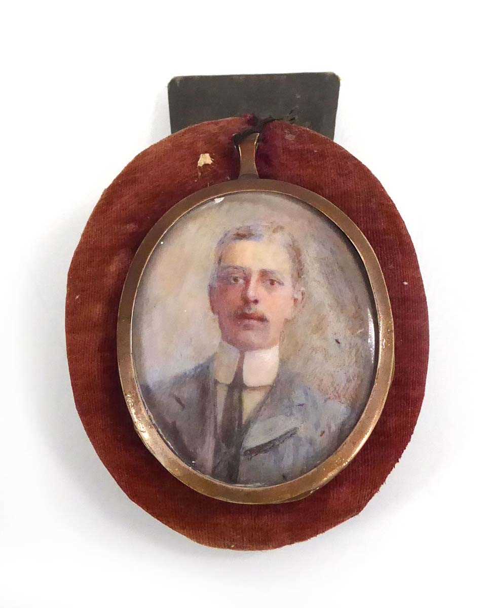 An early 20th century head and shoulders portrait miniature on ivory depicting Claude M Davies,