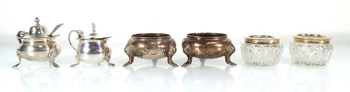 A pair of early 20th century silver salts of squat bun shaped form on hoof feet, Goldsmiths &
