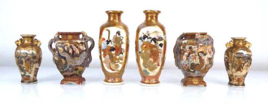 A pair of satsuma vases of squared baluster form, each decorated with traditional figures at