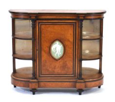 A Victorian burr, strung, ebonised and brass mounted break-front credenza, the door inset with a