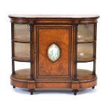 A Victorian burr, strung, ebonised and brass mounted break-front credenza, the door inset with a