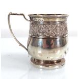 A George III silver and parcel gilt Christening mug with foliate scrolled decoration, maker RE EB,