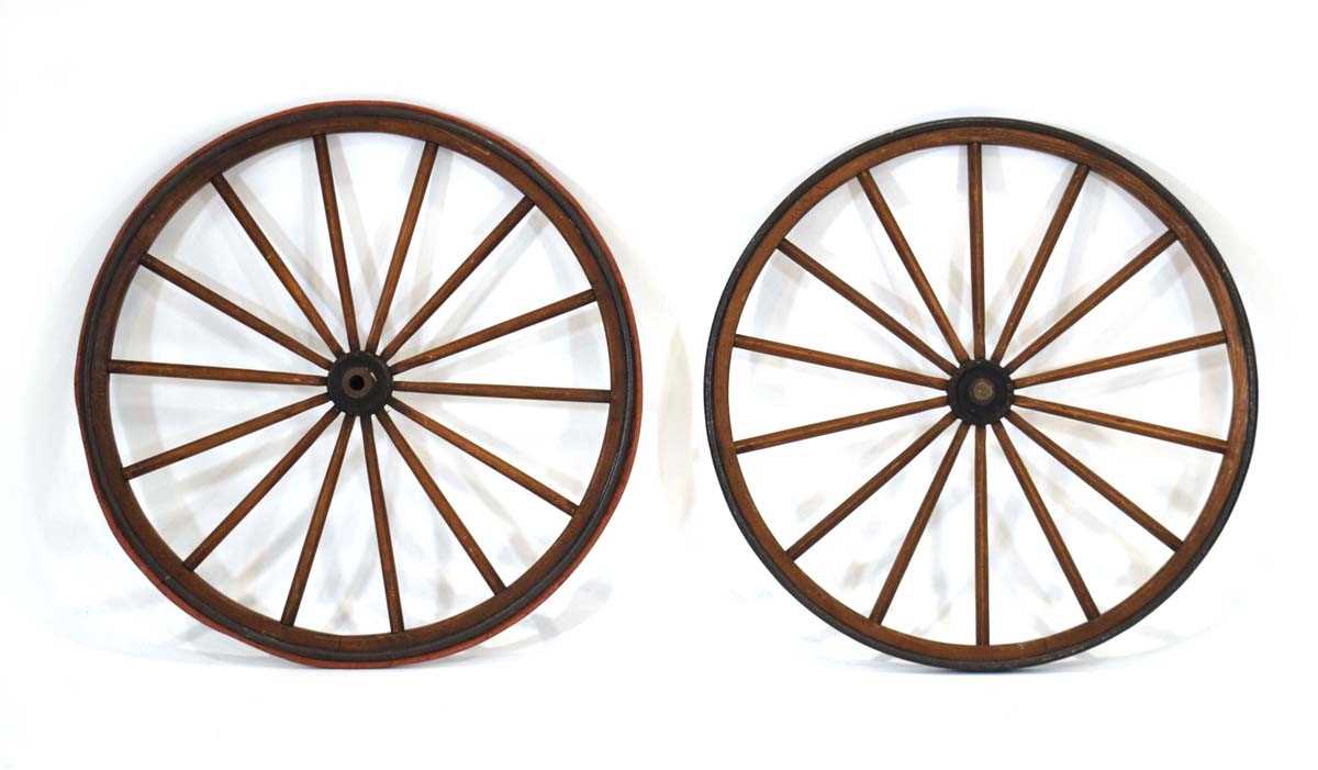 A pair of late 19th/early 20th century Furley & Headley Ashford iron-banded wheels taken from an '