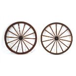 A pair of late 19th/early 20th century Furley & Headley Ashford iron-banded wheels taken from an '