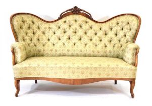 A Victorian walnut and button upholstered drawing room sofa on scrolled front legs, w. 168 cm